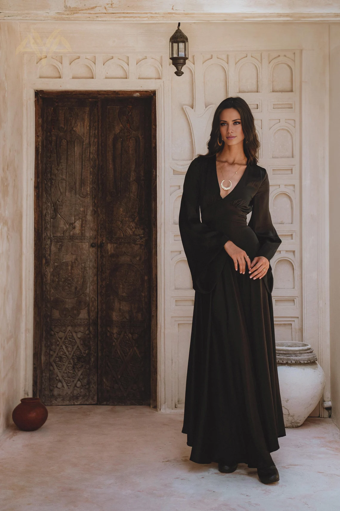 V-neck long sleeved backless and floor length evening dress
