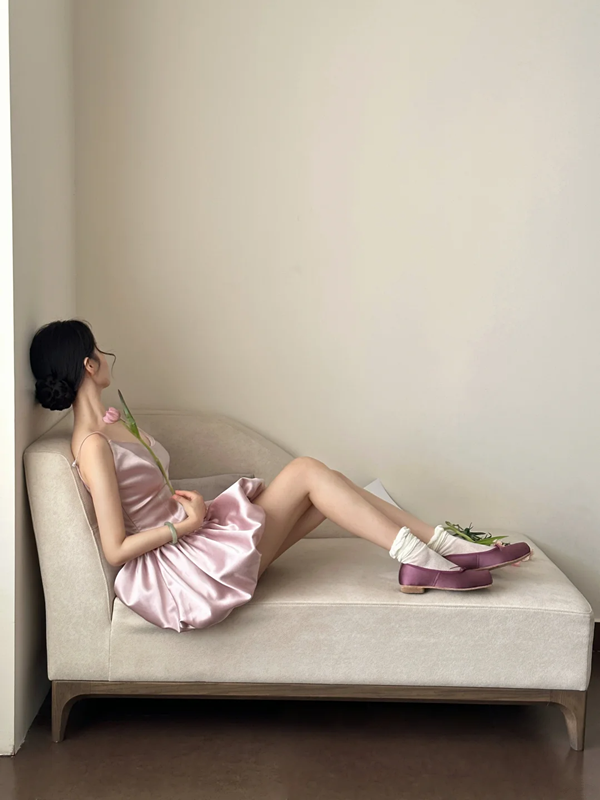 Champagne pink spaghetti strap, waist‑cinching, short ball gown with a fluffy, ruffled bud‑style skirt R7999