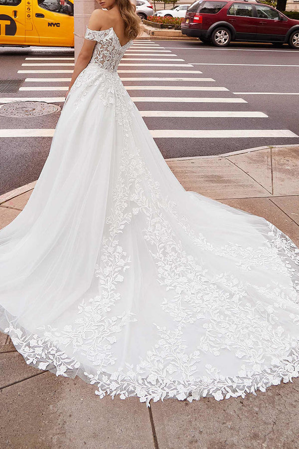 Off the shoulder lace decal with a simple white wedding dress paired with a detachable hem for the bride's dress