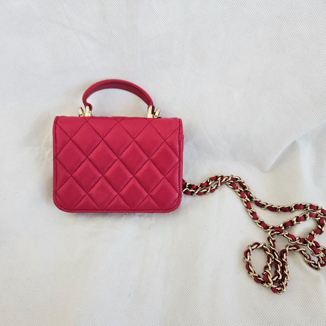 Chanel dark pink quilted lambskin top handle micro top handle flap bag