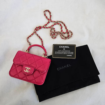 Chanel dark pink quilted lambskin top handle micro top handle flap bag