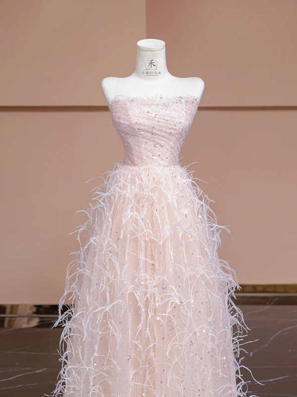 Light pink strapless, fitted waist, long ball gown with feather skirt design; bridal gown R8345
