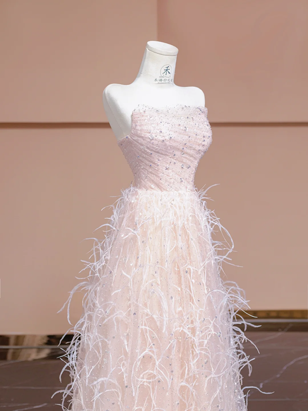 Light pink strapless, fitted waist, long ball gown with feather skirt design; bridal gown R8345