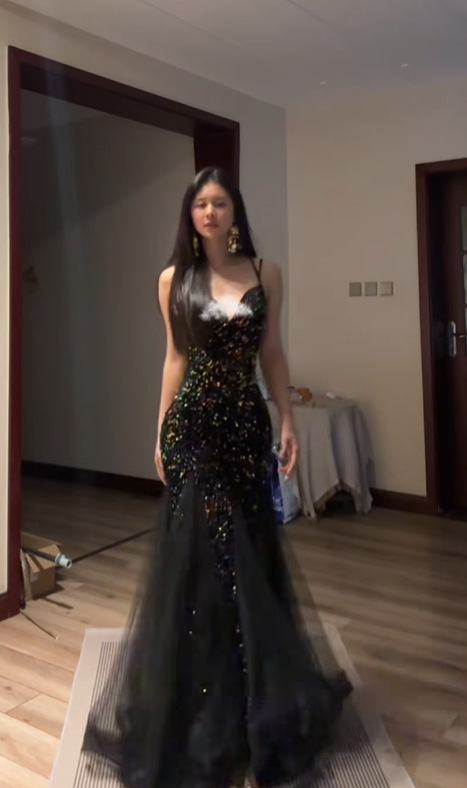 Sexy ball gown with black halter neck, fitted waist, and sequined fishtail skirt. R8065