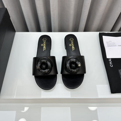 Chanel CC Mules With Camellia In Black
