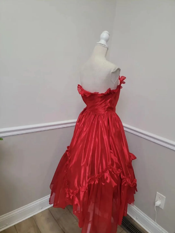 Red strapless ball gown with a cinched waist and an asymmetrical skirt; bridal gown R7297