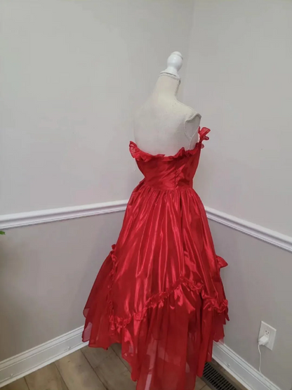 Red strapless ball gown with a cinched waist and an asymmetrical skirt; bridal gown R7297