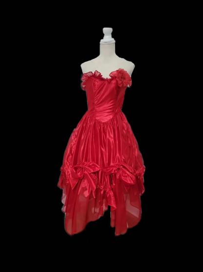 Red strapless ball gown with a cinched waist and an asymmetrical skirt; bridal gown R7297