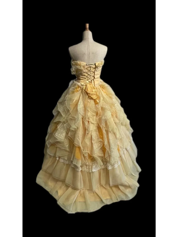 Light orange strapless ball gown with a cinched waist and a voluminous tiered cake skirt; bridal gown R7302