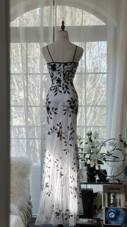 White dress with black floral print, halter neck, fitted waist, elegant long ball gown R7678