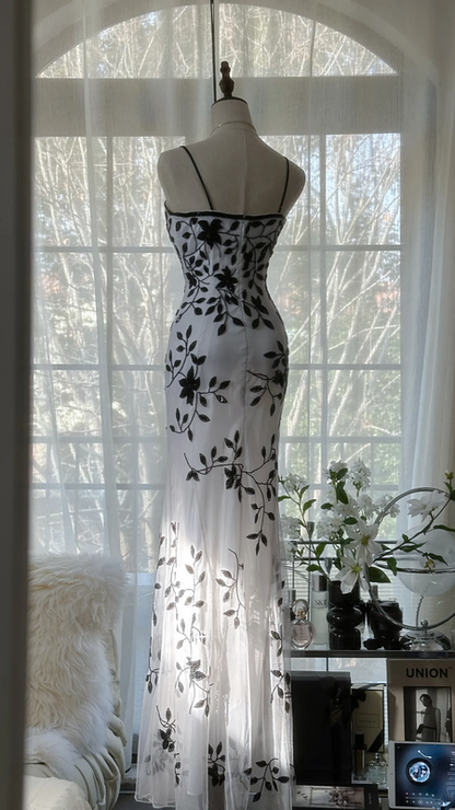 White dress with black floral print, halter neck, fitted waist, elegant long ball gown R7678
