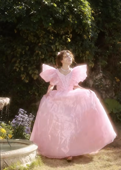 Pink floor-length ball gown with a cinched waist and slim fit, exuding elegance; bridal gown R7280