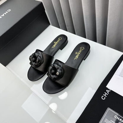 Chanel CC Mules With Camellia In Black