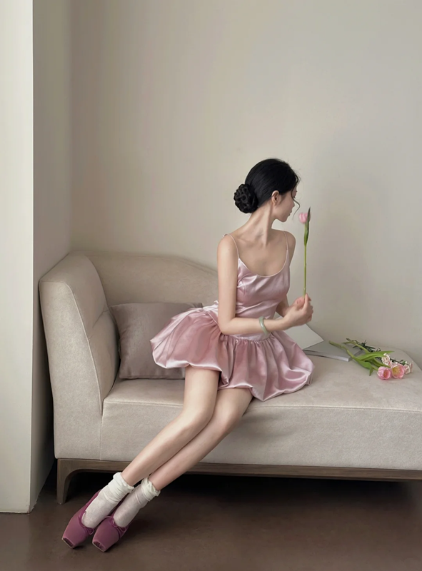Champagne pink spaghetti strap, waist‑cinching, short ball gown with a fluffy, ruffled bud‑style skirt R7999