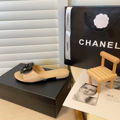 Chanel Black Camellia Slides Beige