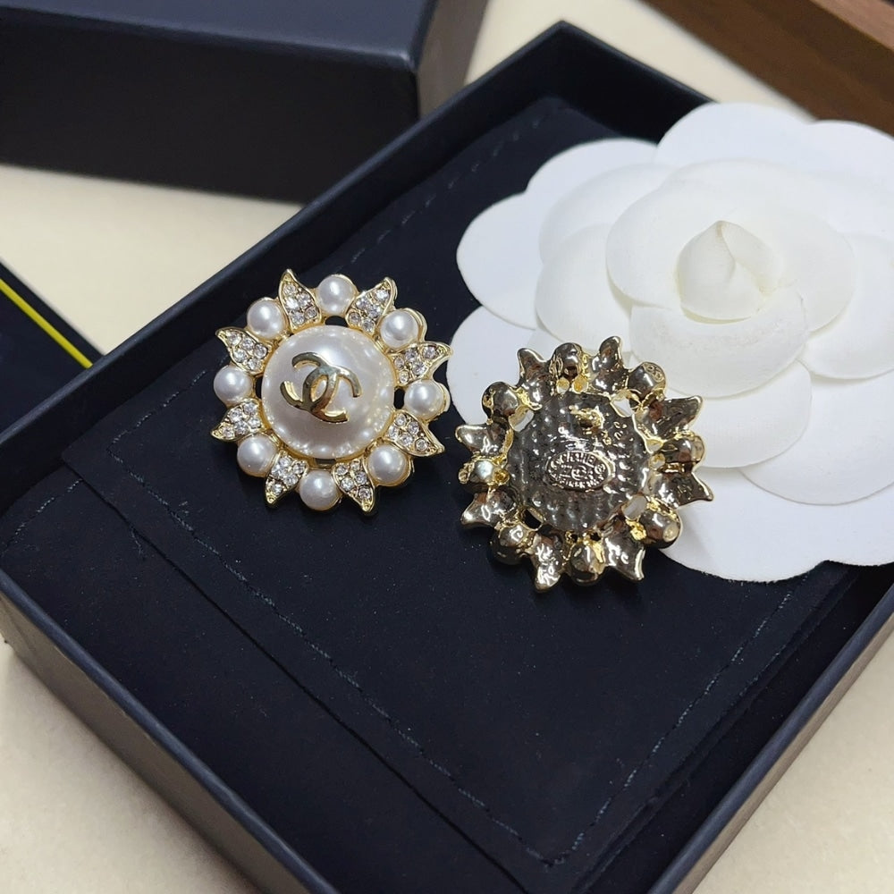 CHANEL SUNBURST PEARL AND CRYSTAL EARRINGS IN GOLD TONE