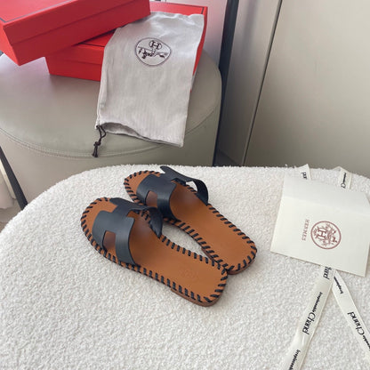 HERMÈS ORAN SANDALS STITCHING IN BLACK AND BROWN