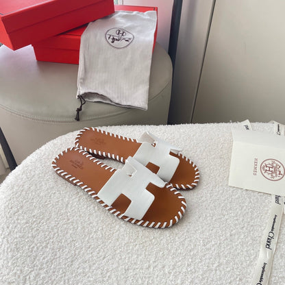 HERMÈS ORAN SANDALS STITCHING IN BROWN AND WHITE