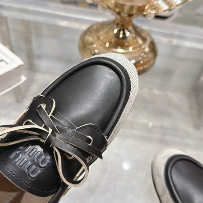 MIUMIU CANVAS AND BLEACHED LEATHER BOAT SHOES BLACK