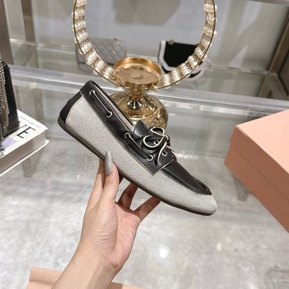 MIUMIU CANVAS AND BLEACHED LEATHER BOAT SHOES BLACK