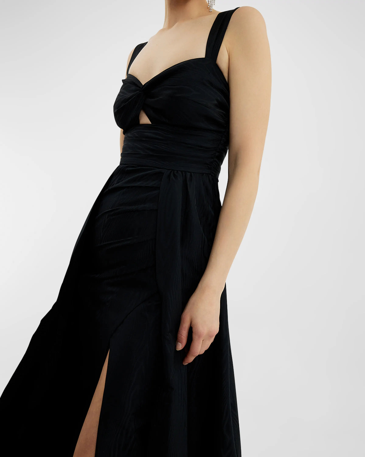 A noble off shoulder pleated hollow and ground length prom dress