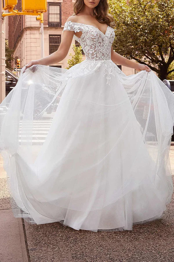 Off the shoulder lace decal with a simple white wedding dress paired with a detachable hem for the bride's dress