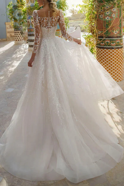 Line illusion neckline long sleeved lace trailing wedding dress